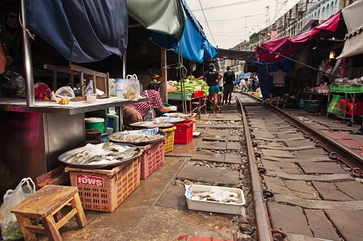 Maeklong Railway Market, a local market commonly called Siang Tai (life-risking) Market. Spreading over a 100-metre length, the market is located by the railway near Mae Klong Railway Station