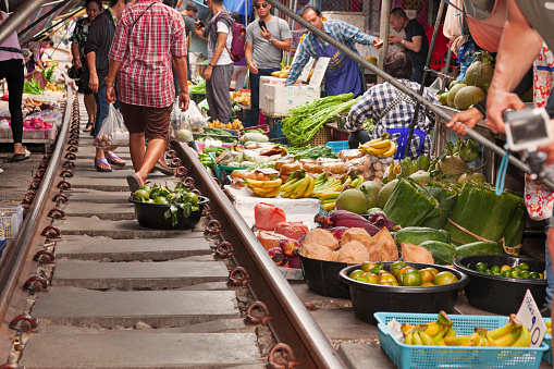 Maeklong Railway Market, a local market commonly called Siang Tai (life-risking) Market. Spreading over a 100-metre length, the market is located by the railway near Mae Klong Railway Station