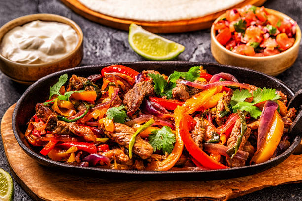 istock FAJITAS with colored pepper and onions 1134749806