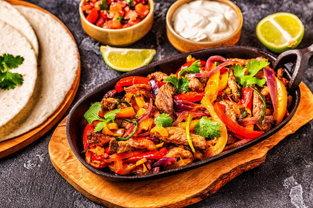 istock FAJITAS with colored pepper and onions 1134749841