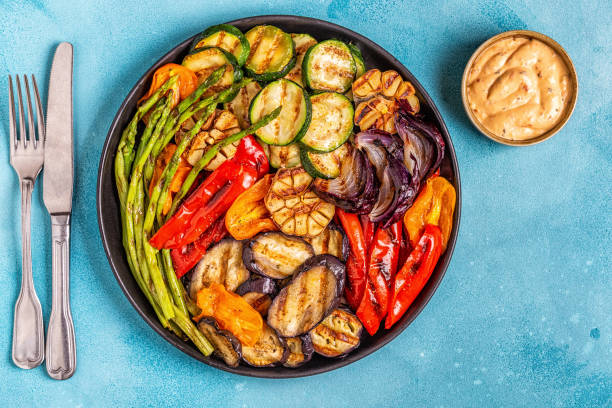 istock Grilled vegetables on a plate with sauce 1134750207