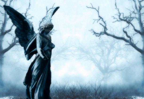 istock illustration of scary graveyard with fog and a statue in front and trees 1134752214