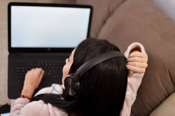 istock Young woman with lap top 1134754775