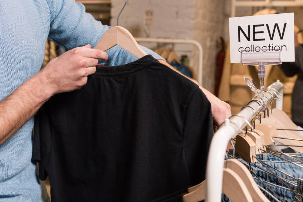 istock Young man buy in clothes at store. Close-up. 1134757638