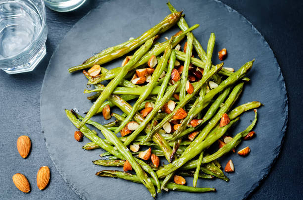 istock Roasted snap green beans with almond slices 1134759182