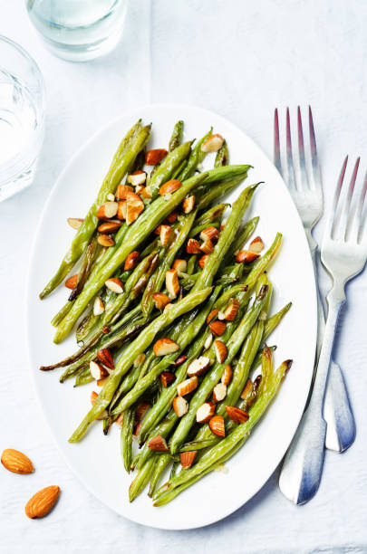 istock Roasted snap green beans with almond slices 1134759259