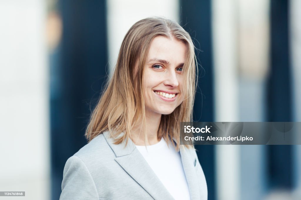 Portrait of beautiful woman near office company Adult Stock Photo