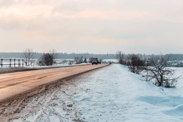 istock Winter road among the fields in the countryside 1134763924