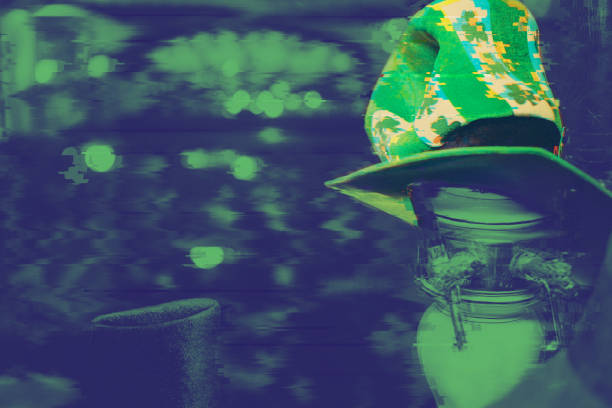 Stylish mature african american man with a newsboy cap and green shirt is walking down the street in a european city, holding a disposable coffee cup and looking away