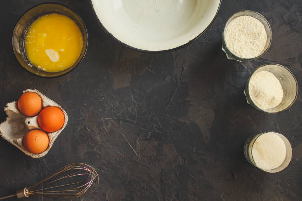 istock raw dough mix ingredients (eggs, flour and others). food background. copy space 1134765084