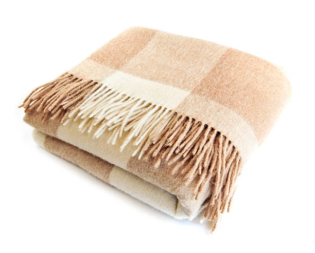 One checkered beige and white alpaca wool blanket
