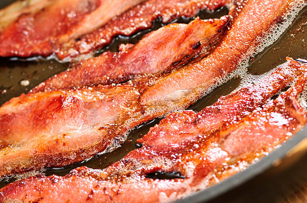 istock Crispy bacon frying in the pan 113476794