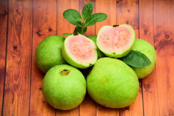 istock fresh guava fruit on wooden background 1134770856