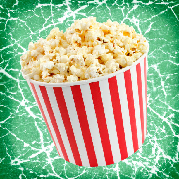 istock Popcorn in red and white cardboard box for cinema or TV 1134773551