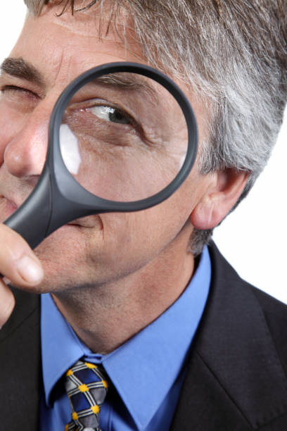 istock Senior businessman uses loupe 1134773594