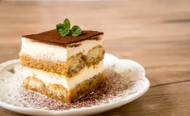 Fresh Tiramisu Cake on the table,  white background