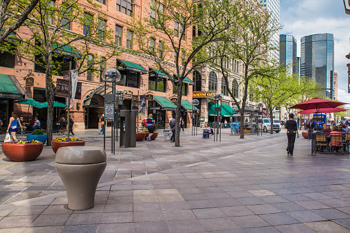 Denver, Colorado, USA - April 30. 2018: View of landmark 16th Street Mall, outdoor shopping district in the city of Denver Colorado with people visible.