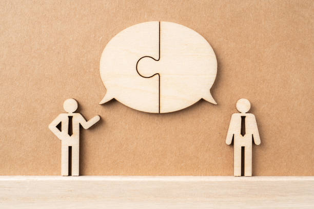 istock wooden businessman with conversation concept 1134781058