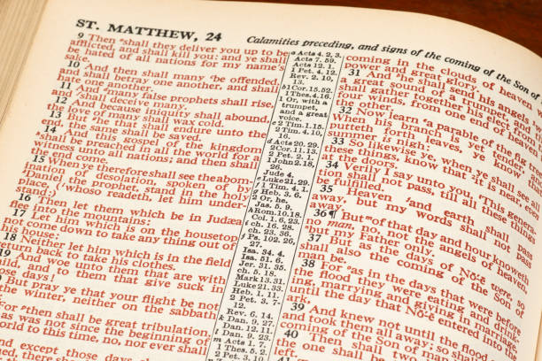 Words of Christ in Red From Bible Page Horizontal close-up shot of an open Bible show Matthew 24 in red print. new testament stock pictures, royalty-free photos & images