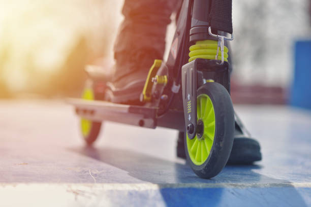 istock Close-up wheel from kick scooter on blue skatepark against warm sunset light 1134785061