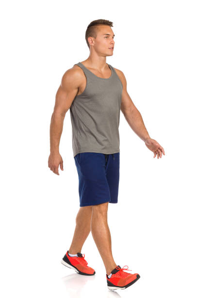 istock Man Walking In Sport Clothes And Looking Away. Front Side View. Isolated 1134790241