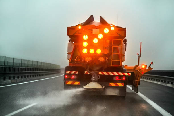 istock Highway maintenance gritter truck spreading de icing salt on road 1134790796