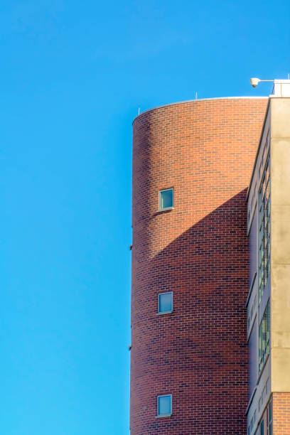 istock Building with surveillance camera against blue sky 1134795688