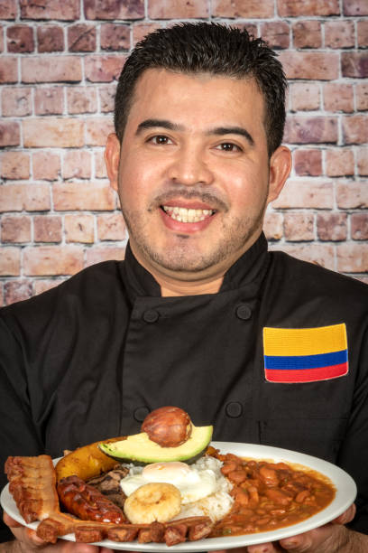 istock Colombian Chef holding a bandeja paisa (typical Colombian dish) 1134797034