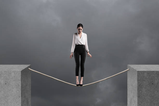 istock Businesswoman standing looking down on a rope 1134798802