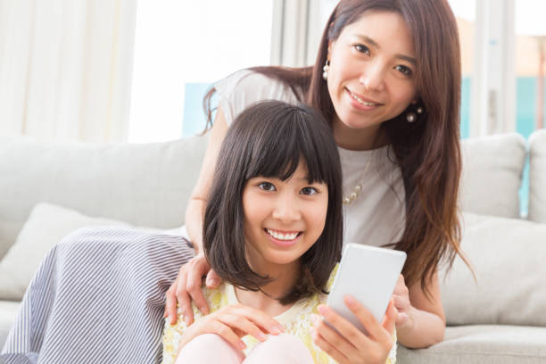 istock asian parent and daughter 1134807098