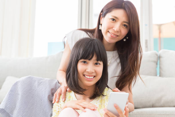 istock asian parent and daughter 1134807263