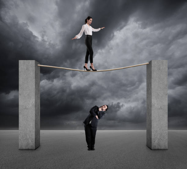 istock Businesswoman walking on a rope 1134807290