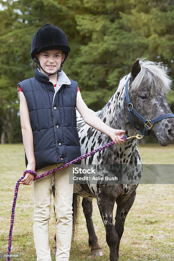 Girl standing with horse  Children Only Stock Photo