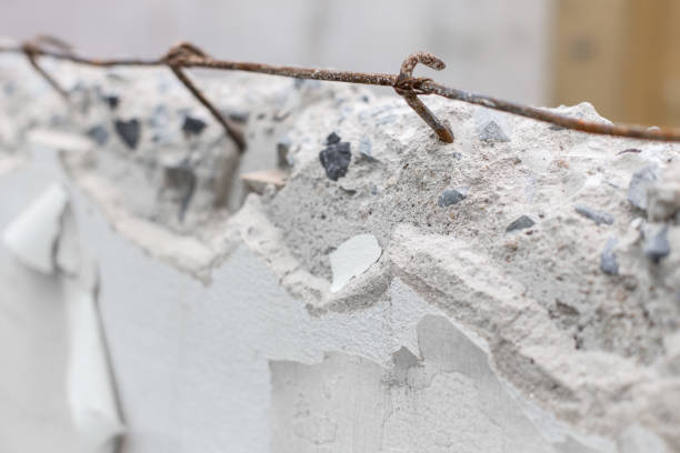 istock Selective focus of Masonry wall is broken and rust steel bar texture background 1134815224