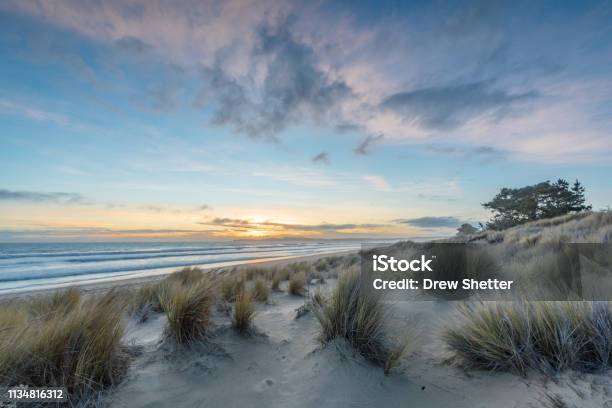 Sunset With Colorful Sky And Reflections In Waves Stock Photo - Download Image Now - Beach, California, Sand Dune