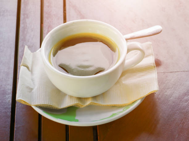 istock black coffee in cup white on table wood floor background in morning 1134822139