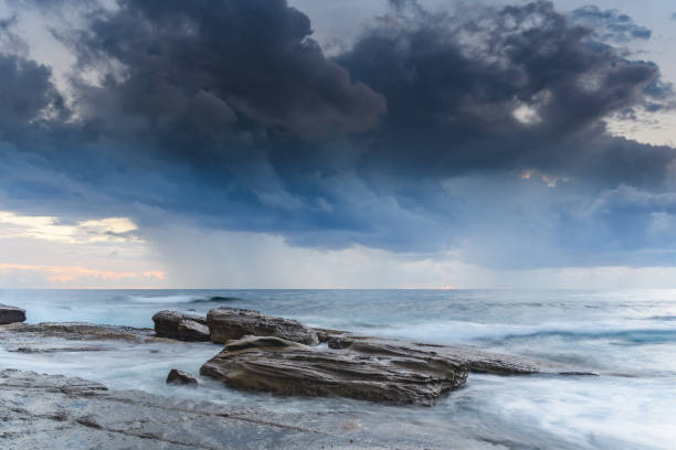 istock Rocky Seascape with Dark Clouds 1134826436
