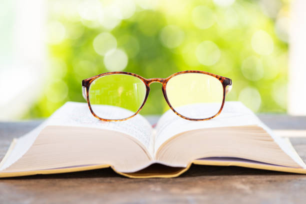 istock Glasses and books on windows and tables 1134829785