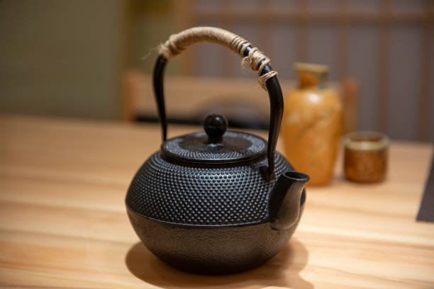 istock Japanese traditional black iron flat round teapot 1134831454