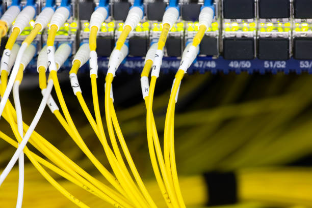 istock Close up fiber optic in server room , network cables installed in the rack Abstract image for use as a background 1134833534