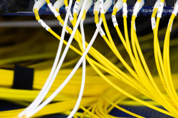 istock Close up fiber optic in server room , network cables installed in the rack Abstract image for use as a background 1134834092