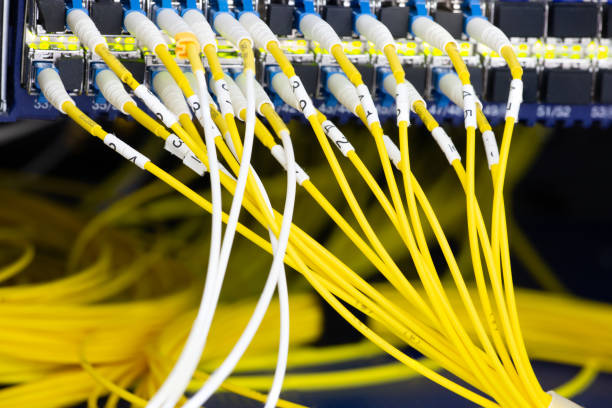 istock Close up fiber optic in server room , network cables installed in the rack Abstract image for use as a background 1134834383
