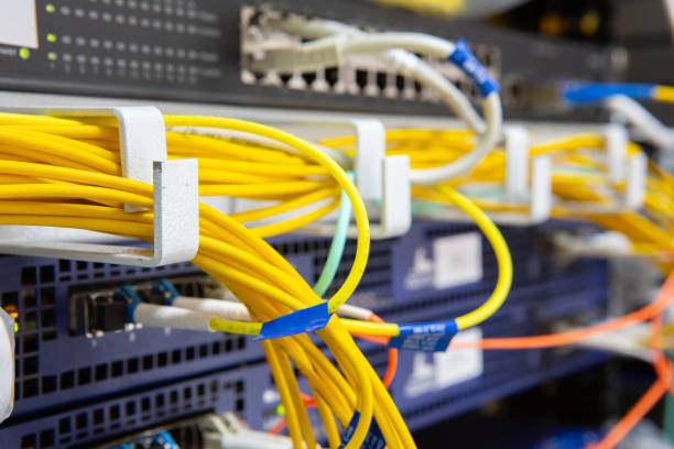 istock Server front side showing colorful switches and wiring Abstract blurred image for use as a background 1134834474