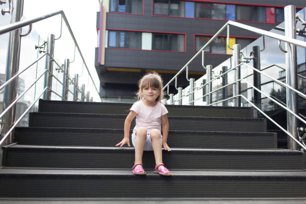 istock Young girl sitting on the steps 1134836079