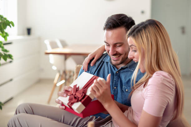 istock Cheerful young couple celebrating at home 1134836563