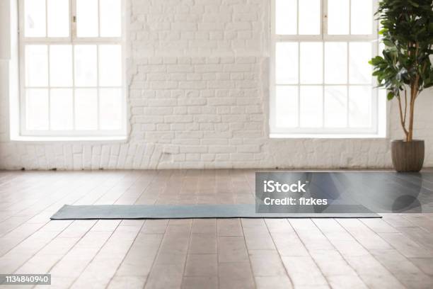 Yoga Mat On Natural Wooden Floor In Empty Room Stock Photo - Download Image Now - Domestic Room, Yoga, Studio - Workplace