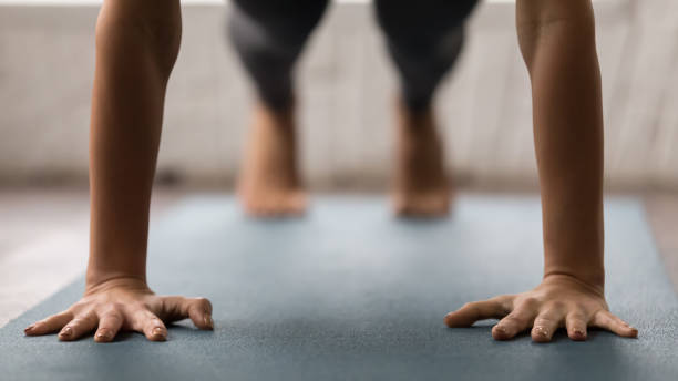 istock Woman practicing yoga, Plank pose, Push ups or press ups 1134841020