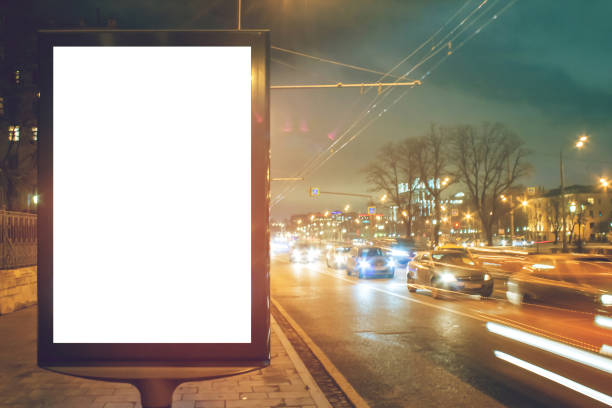 istock Blank white lightbox at night with car lights in motion blur 1134842270