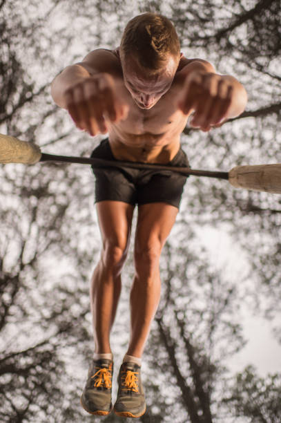 istock Calisthenics young male outdoors hanging upside down 1134842377