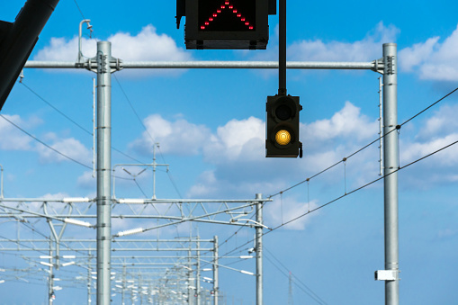 Traffic green light over the Railroad tracks or subway inn blue sky day, transportation concept